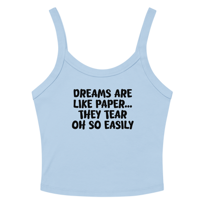 "Dreams are like paper, they tear oh so easily" printed on a solid baby blue blend women's micro-rib tanktop laying on a flat surface amongst sunglasses and shorts
