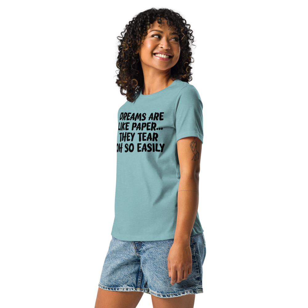 "Dreams are like paper, they tear oh so easily" printed on a heather blue lagoon women's relaxed t-shirt worn by a female