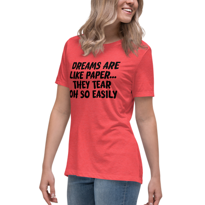 "Dreams are like paper, they tear oh so easily" printed on a heather red women's relaxed t-shirt worn by a female