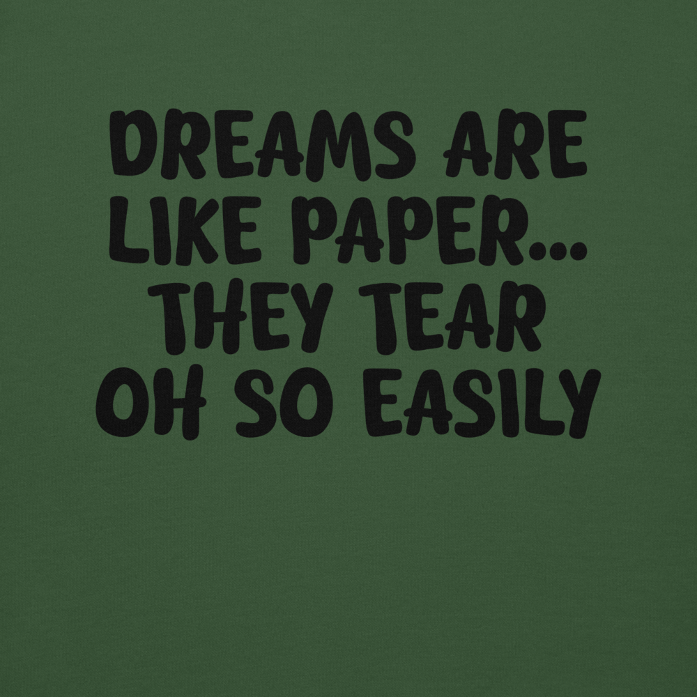 "Dreams are like paper, they tear oh so easily" printed on a forest green background