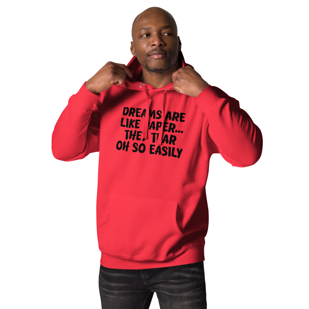 "Dreams are like paper, they tear oh so easily" printed on a team red unisex hoodie worn by a male