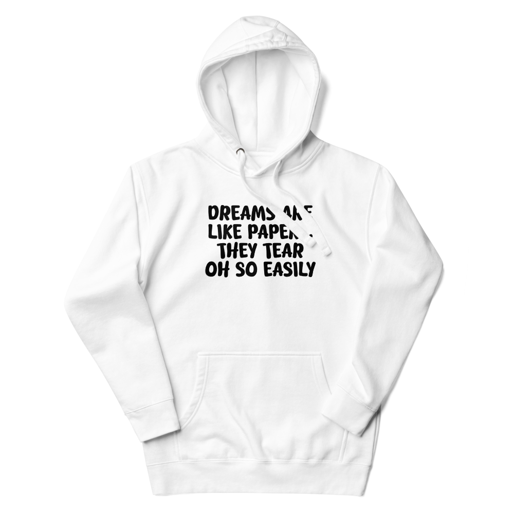 "Dreams are like paper, they tear oh so easily" printed on a white unisex hoodie laying on a flat surface with the hood up