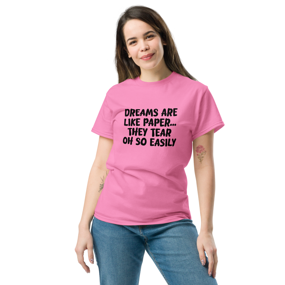 "Dreams are like paper, they tear oh so easily" printed on a azalea unisex classic tee worn by a female