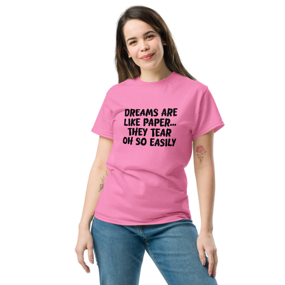 "Dreams are like paper, they tear oh so easily" printed on a azalea unisex classic tee worn by a female