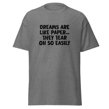 "Dreams are like paper, they tear oh so easily" printed on a graphite heather unisex classic tee laying on a flat surface