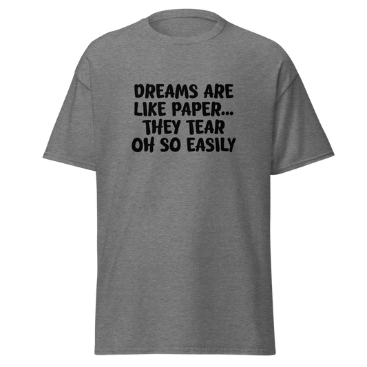 "Dreams are like paper, they tear oh so easily" printed on a graphite heather unisex classic tee laying on a flat surface