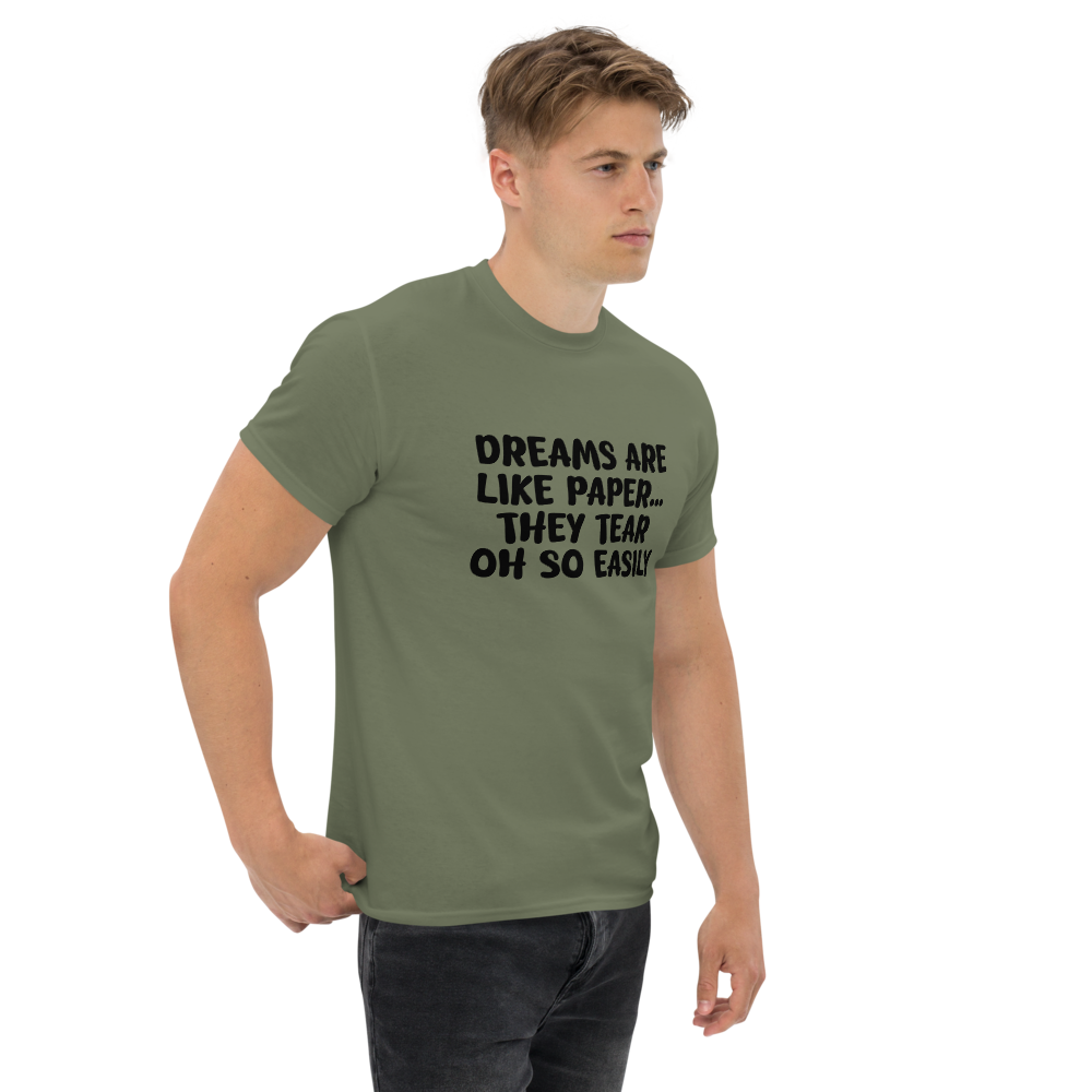 "Dreams are like paper, they tear oh so easily" printed on a military green unisex classic tee worn by a male