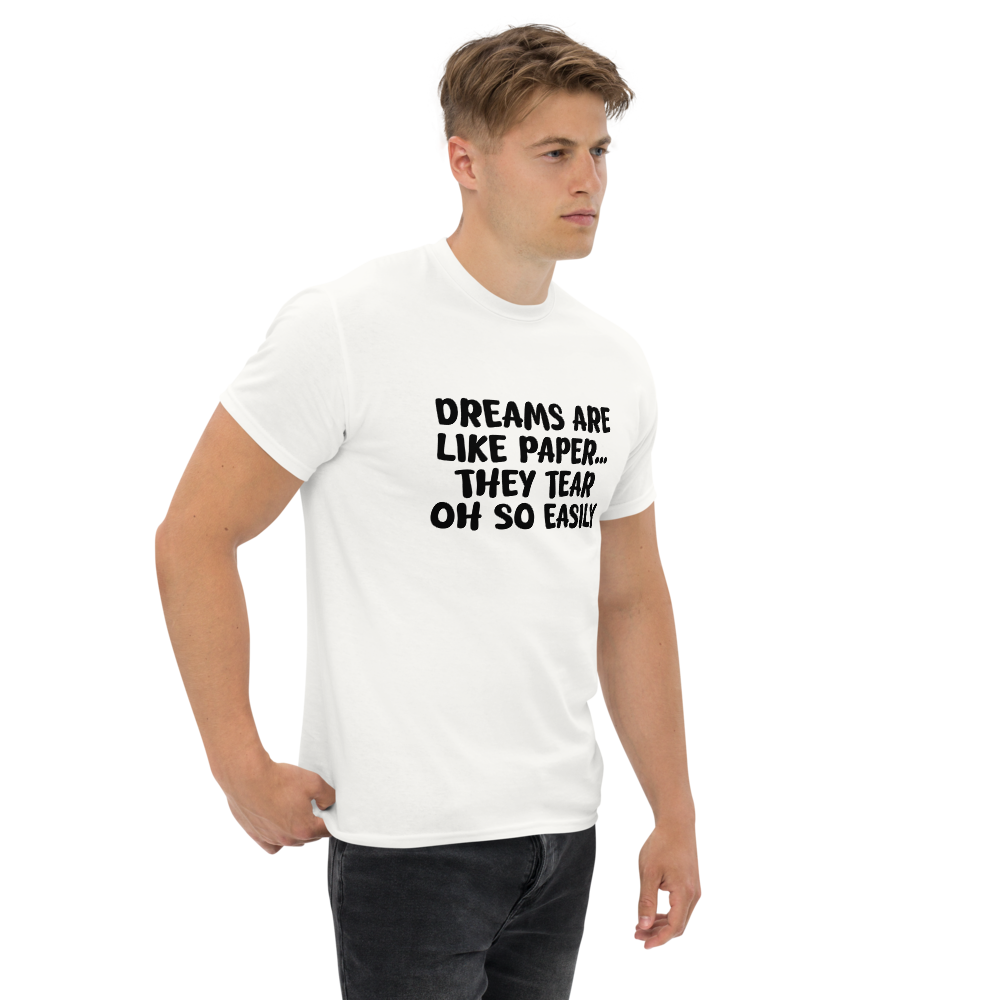 "Dreams are like paper, they tear oh so easily" printed on a white unisex classic tee worn by a male