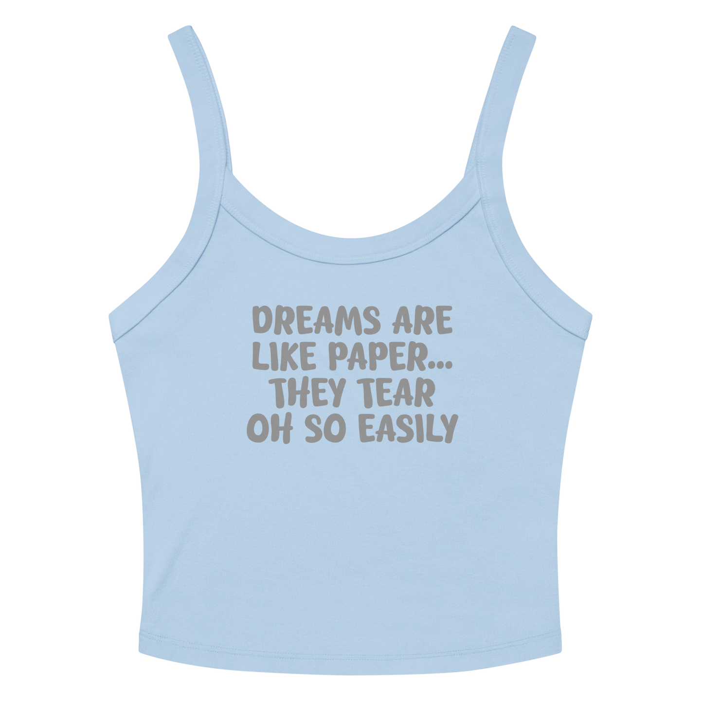 "Dreams are like paper, they tear oh so easily" printed on a solid baby blue blend women's micro-rib tanktop laying on a flat surface amongst sunglasses and shorts