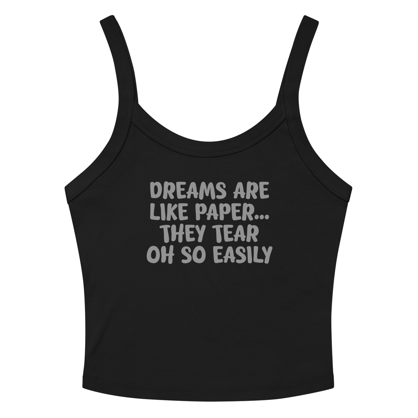 "Dreams are like paper, they tear oh so easily" printed on a solid black blend women's micro-rib tanktop laying on a flat surface amongst sunglasses and shorts