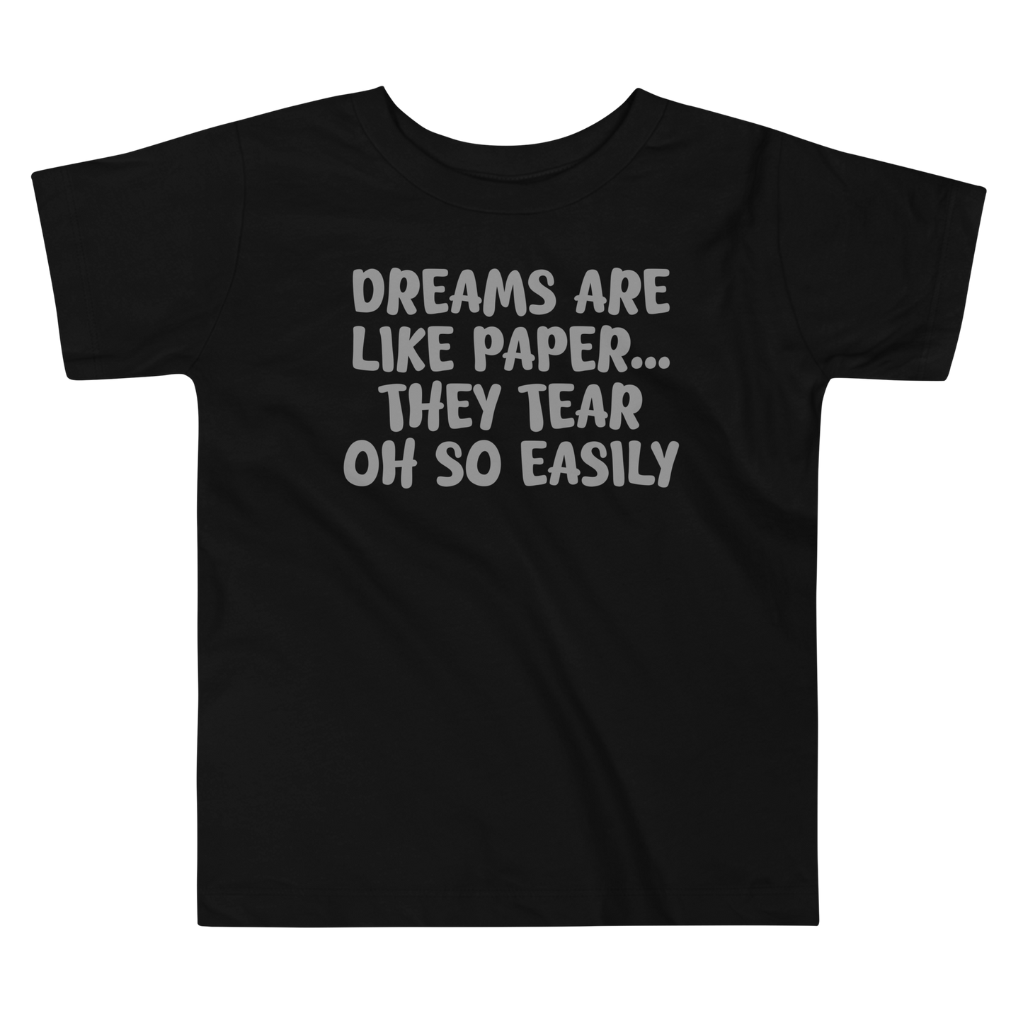 "Dreams are like paper, they tear oh so easily" printed on a black toddler short sleeve tee laying on a flat surface