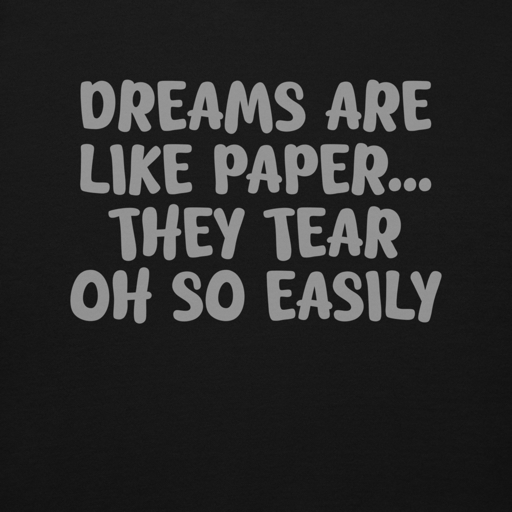 "Dreams are like paper, they tear oh so easily" printed on a black background
