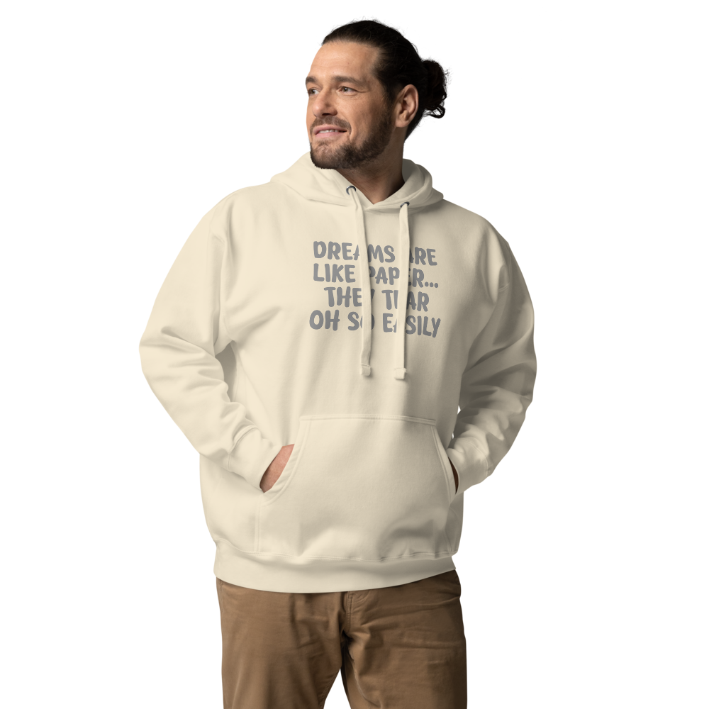 "Dreams are like paper, they tear oh so easily" printed on a bone unisex hoodie worn by a male