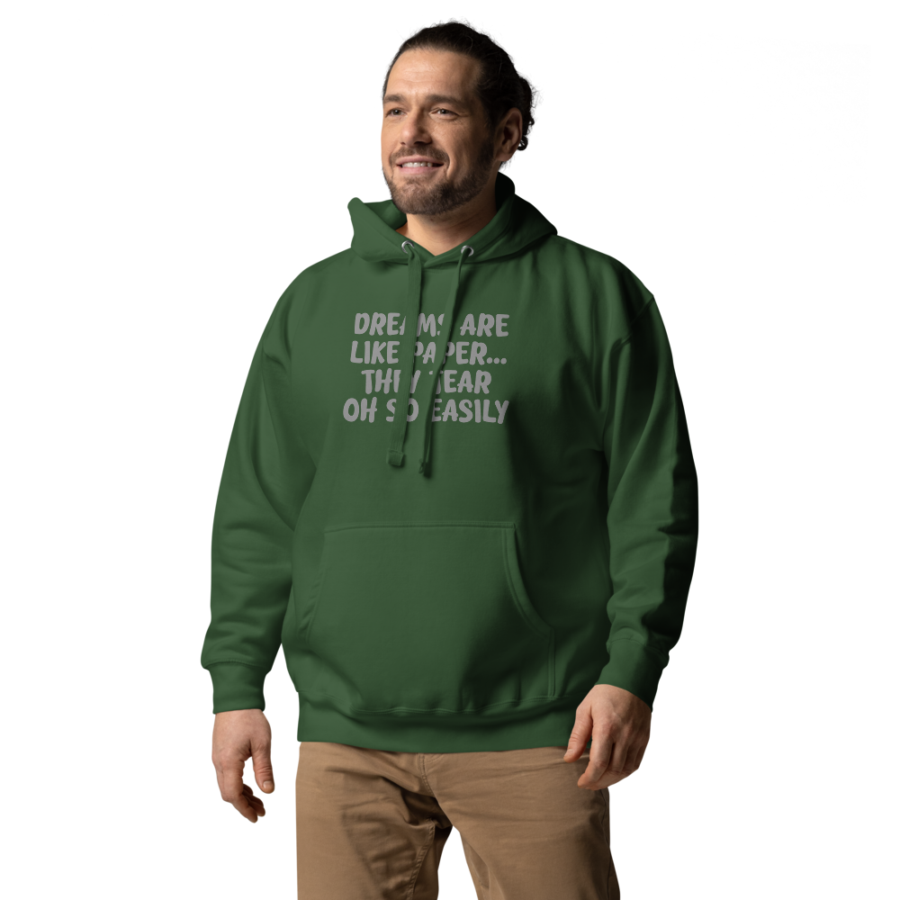 "Dreams are like paper, they tear oh so easily" printed on a forest green unisex hoodie worn by a male