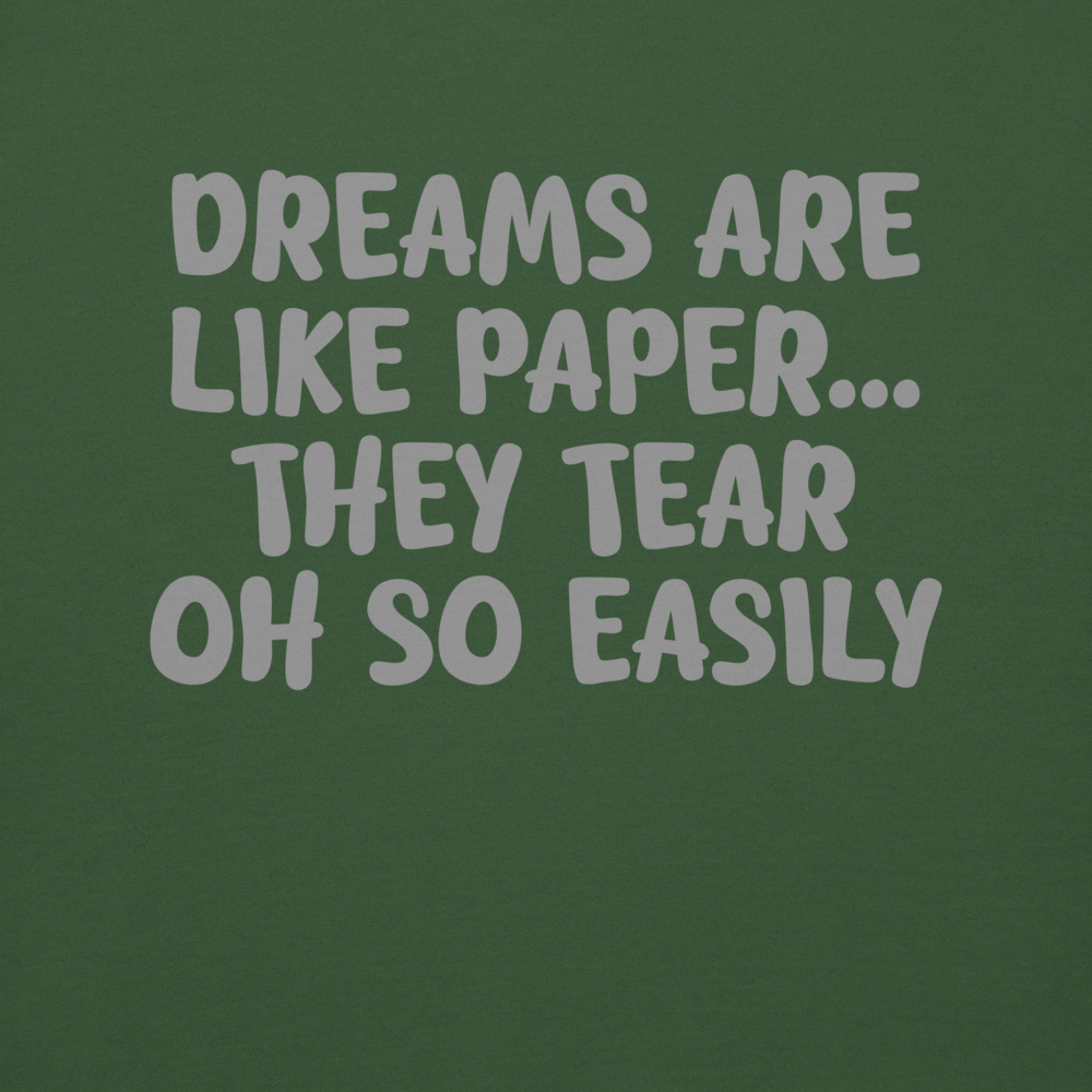 "Dreams are like paper, they tear oh so easily" printed on a forest green background