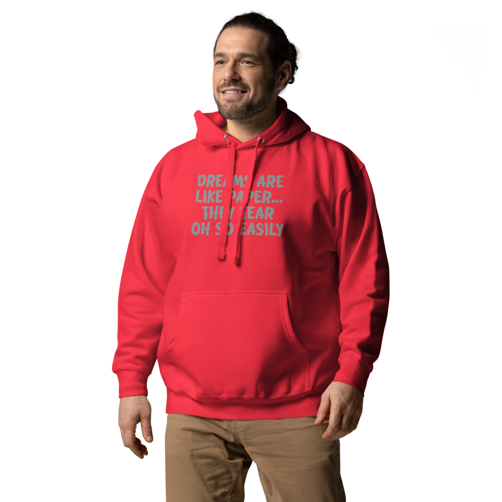 "Dreams are like paper, they tear oh so easily" printed on a team red unisex hoodie worn by a male