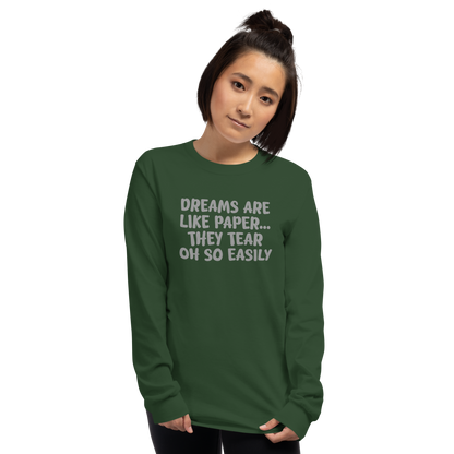 "Dreams are like paper, they tear oh so easily" printed on a forest green men's long sleeve shirt worn by a female
