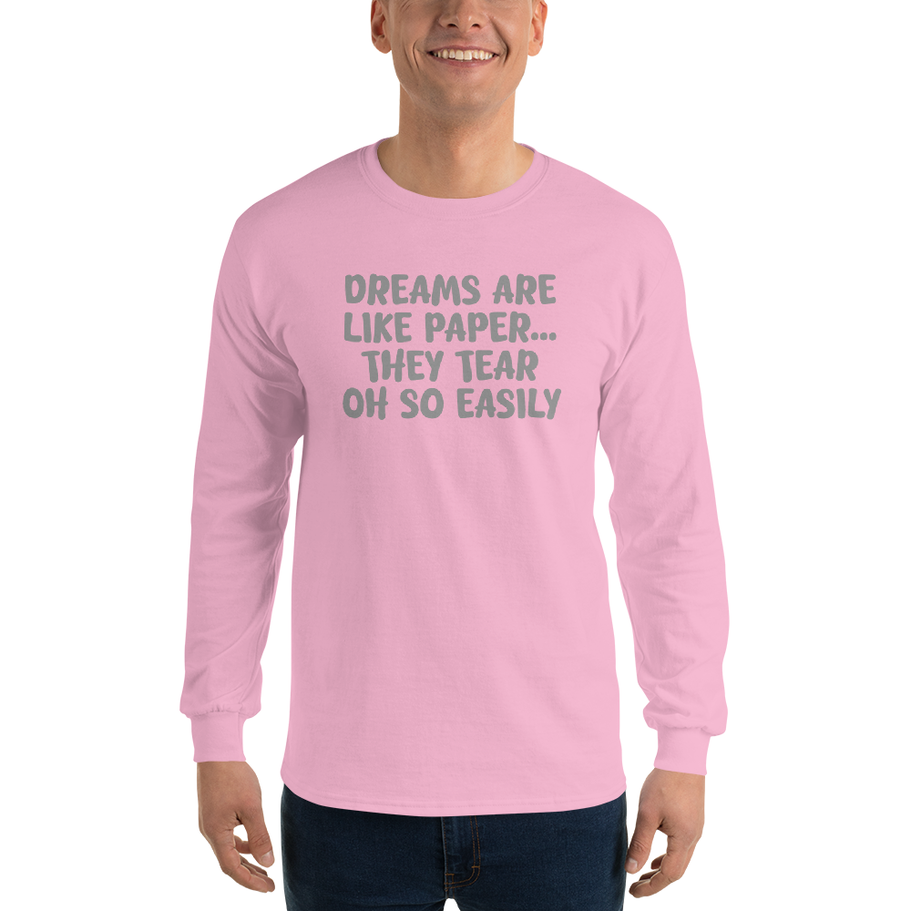 "Dreams are like paper, they tear oh so easily" printed on a light pink men's long sleeve shirt worn by a male