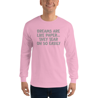 "Dreams are like paper, they tear oh so easily" printed on a light pink men's long sleeve shirt worn by a male