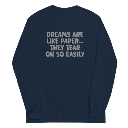 "Dreams are like paper, they tear oh so easily" printed on a navy men's long sleeve shirt laying on a flat surface
