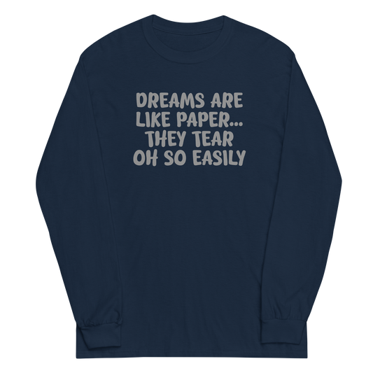 "Dreams are like paper, they tear oh so easily" printed on a navy men's long sleeve shirt laying on a flat surface