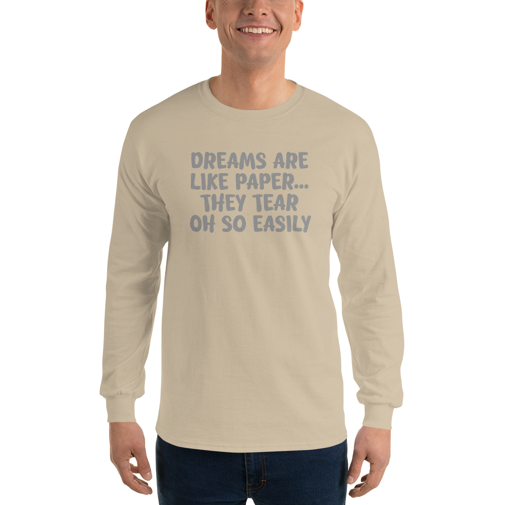 "Dreams are like paper, they tear oh so easily" printed on a sand men's long sleeve shirt worn by a male