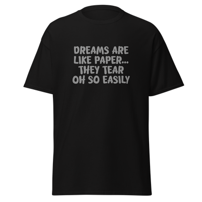 "Dreams are like paper, they tear oh so easily" printed on a black on an invisible body