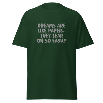 "Dreams are like paper, they tear oh so easily" printed on a forest green on an invisible body