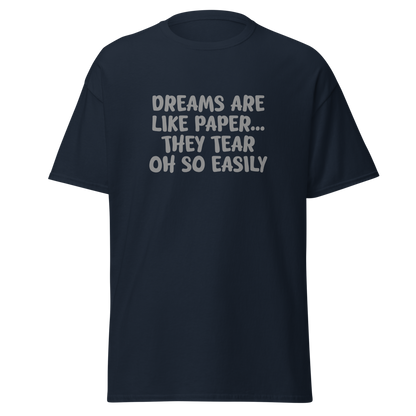 "Dreams are like paper, they tear oh so easily" printed on a navy on an invisible body