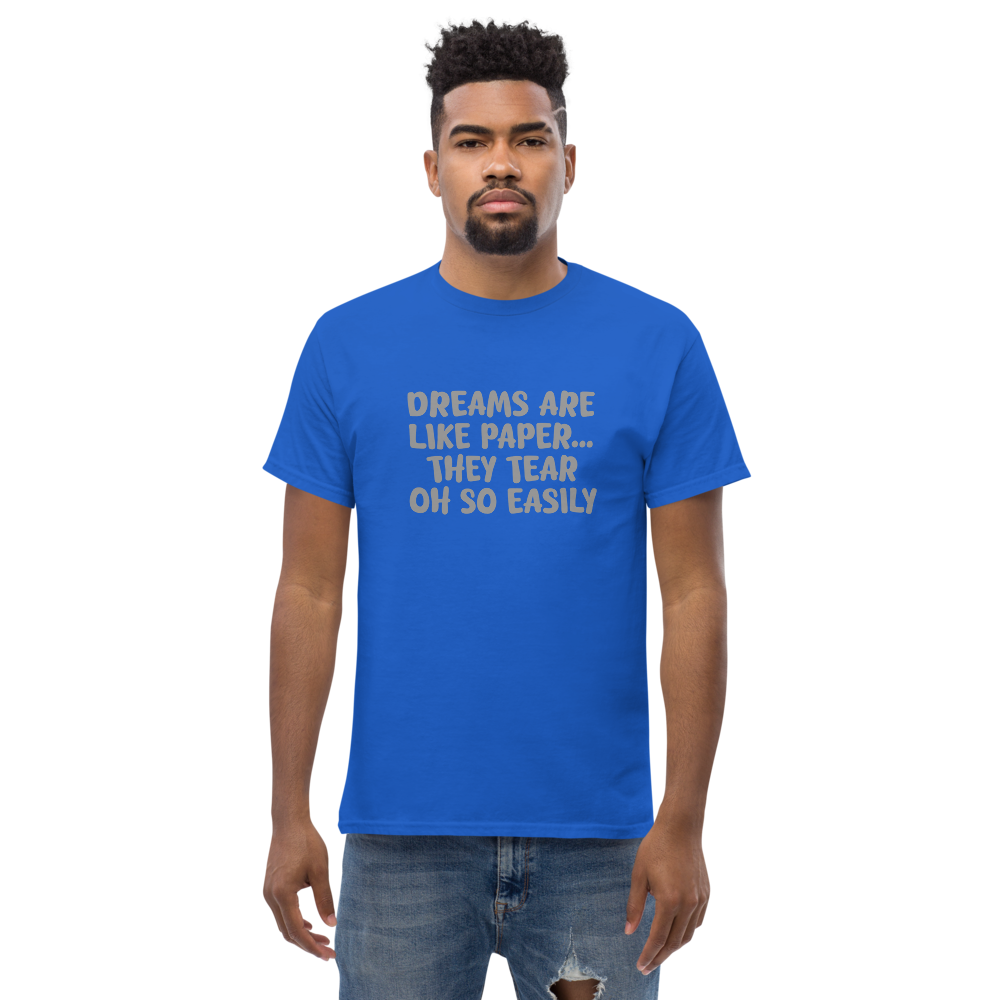 "Dreams are like paper, they tear oh so easily" printed on a royal unisex classic tee worn by a male