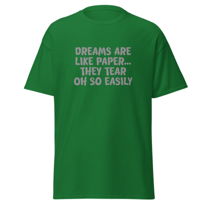 "Dreams are like paper, they tear oh so easily" printed on a turf green on an invisible body