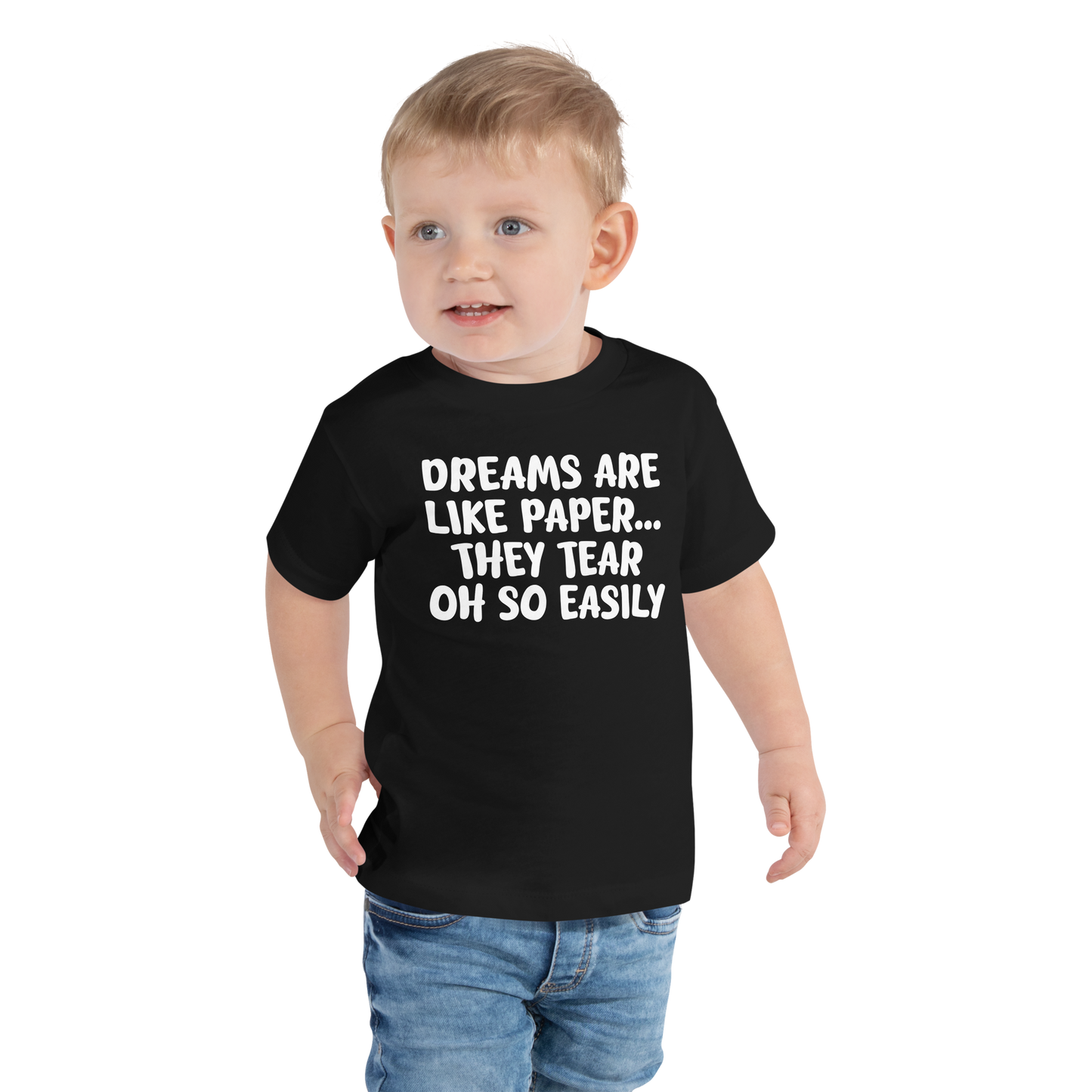 "Dreams are like paper, they tear oh so easily" printed on a black toddler short sleeve tee worn by a male