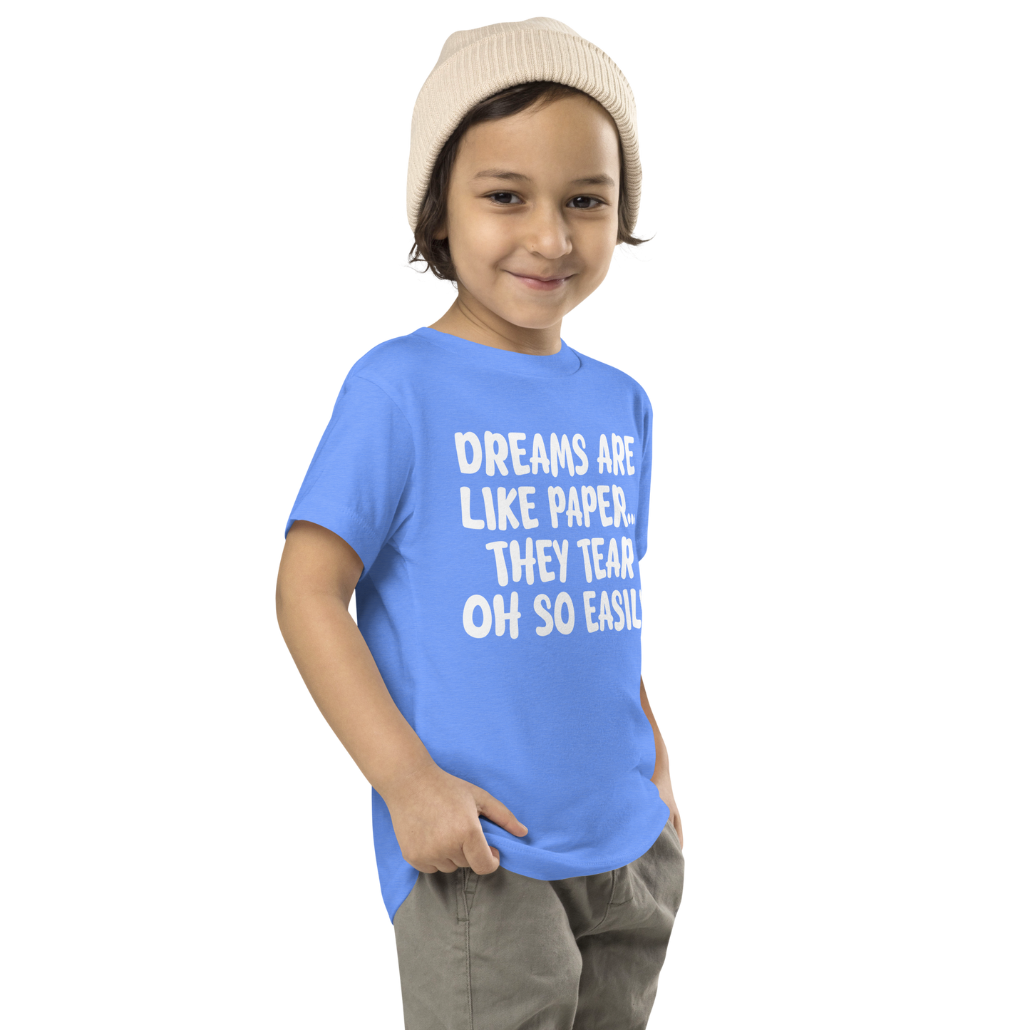 "Dreams are like paper, they tear oh so easily" printed on a heather columbia blue toddler short sleeve tee worn by a male who is also wearing a knit cap