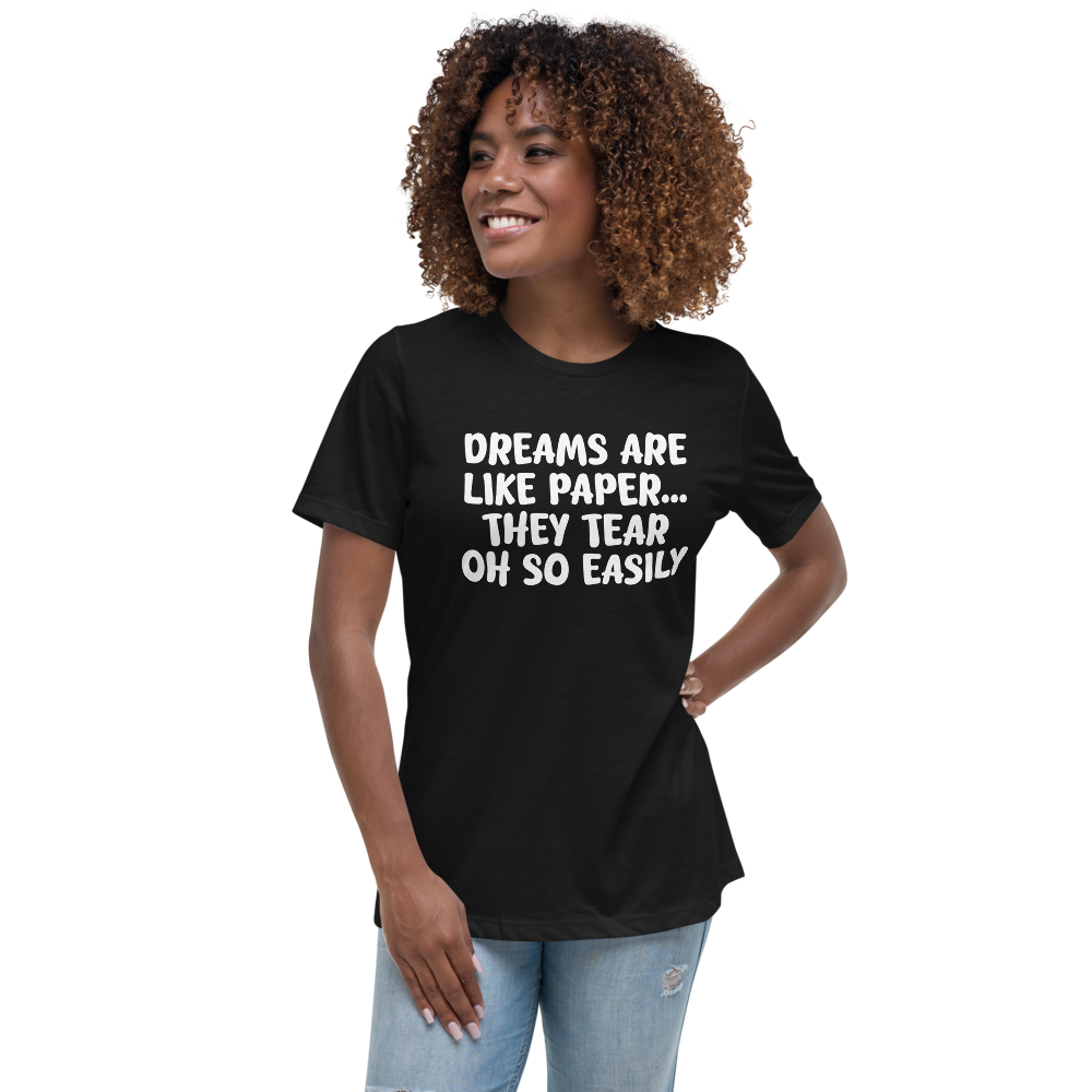 "Dreams are like paper, they tear oh so easily" printed on a black women's relaxed t-shirt worn by a female