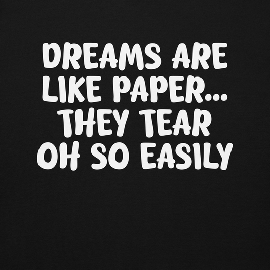 "Dreams are like paper, they tear oh so easily" printed on a black background