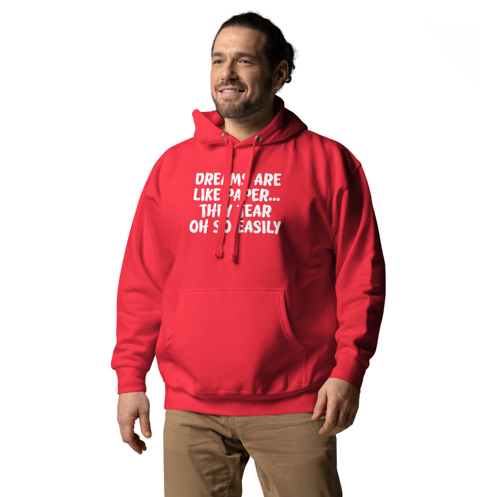 "Dreams are like paper, they tear oh so easily" printed on a team red unisex hoodie worn by a male
