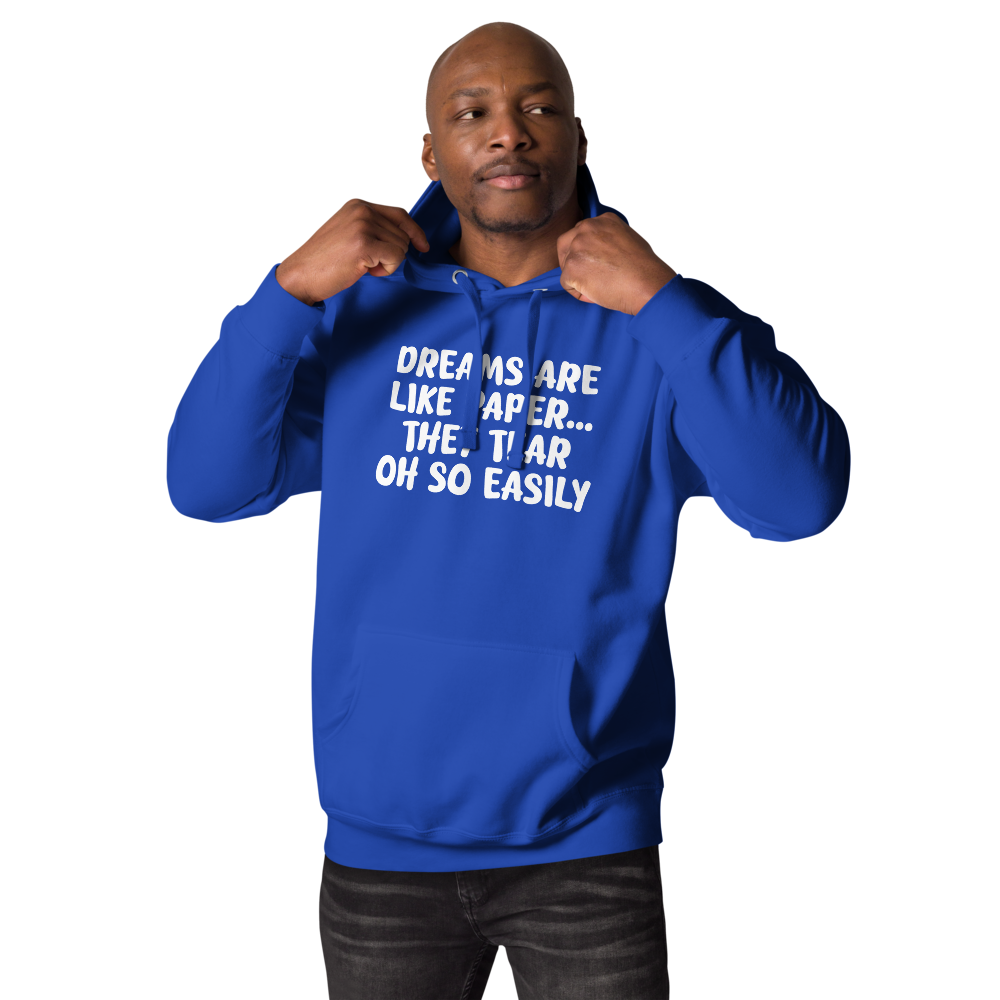 "Dreams are like paper, they tear oh so easily" printed on a team royal unisex hoodie worn by a male