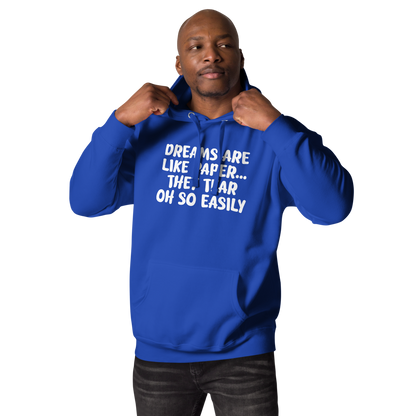 "Dreams are like paper, they tear oh so easily" printed on a team royal unisex hoodie worn by a male