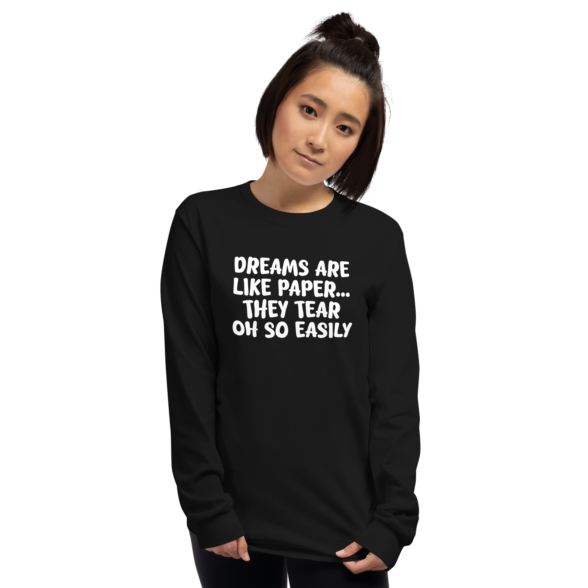"Dreams are like paper, they tear oh so easily" printed on a black men's long sleeve shirt worn by a female