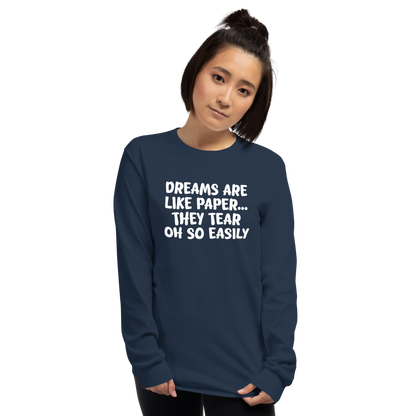 "Dreams are like paper, they tear oh so easily" printed on a navy men's long sleeve shirt worn by a female