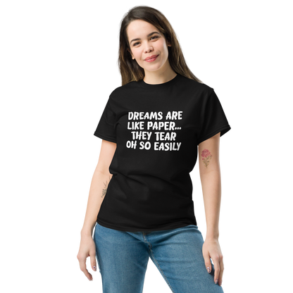 "Dreams are like paper, they tear oh so easily" printed on a black unisex classic tee worn by a female