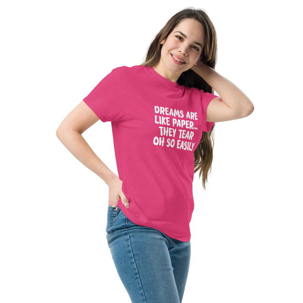 "Dreams are like paper, they tear oh so easily" printed on a heliconia unisex classic tee worn by a female