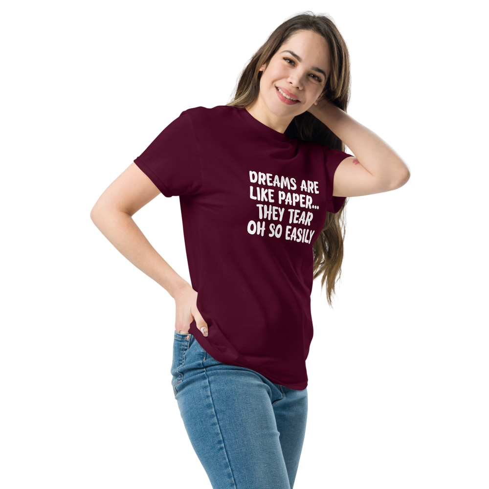 "Dreams are like paper, they tear oh so easily" printed on a maroon unisex classic tee worn by a female