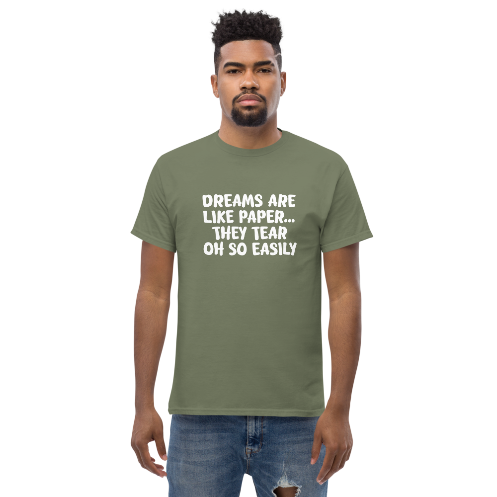 "Dreams are like paper, they tear oh so easily" printed on a military green unisex classic tee worn by a male