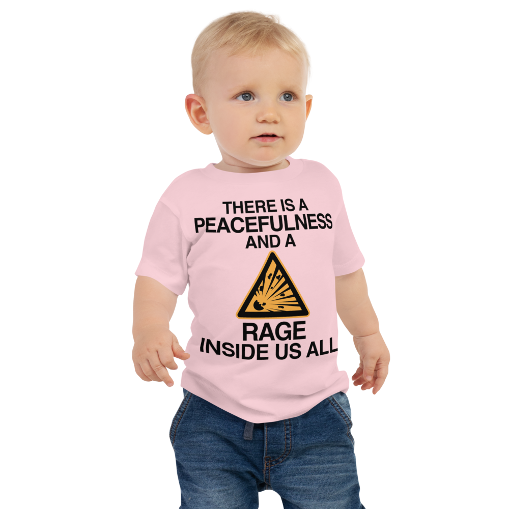 "There is a peacefulness and a rage inside us all" printed on a pink baby jersey short sleeve tee worn by a male