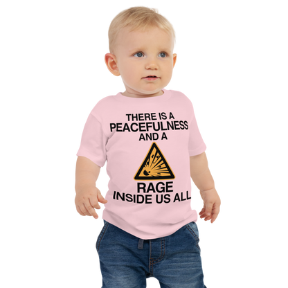 "There is a peacefulness and a rage inside us all" printed on a pink baby jersey short sleeve tee worn by a male