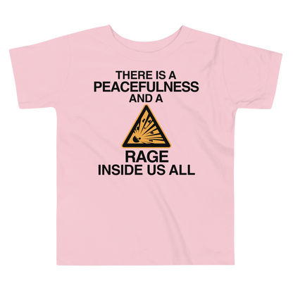 "There is a peacefulness and a rage inside us all" printed on a pink toddler short sleeve tee laying on a flat surface