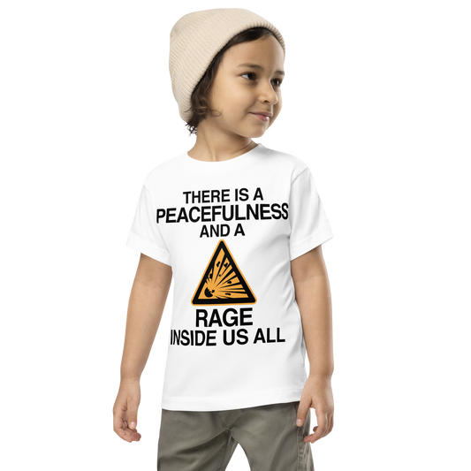 "There is a peacefulness and a rage inside us all" printed on a white toddler short sleeve tee worn by a male wearing a cap