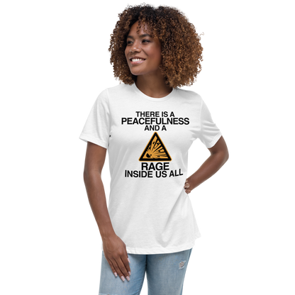 "There is a peacefulness and a rage inside us all" printed on a white women's relaxed t-shirt worn by a female