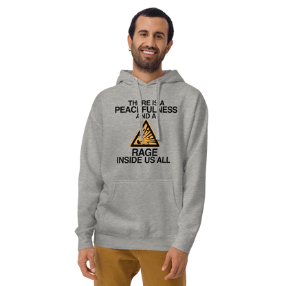 "There is a peacefulness and a rage inside us all" printed on a carbon grey warn by a male